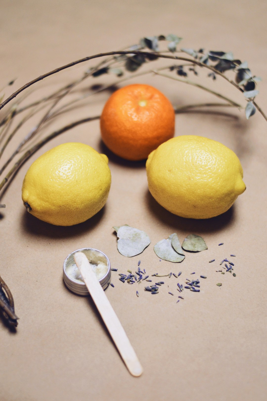 about-01 yellow-lemon-fruit-beside-silver-fork-on-white-and-blue-floral-textile-1j1mezbag4i